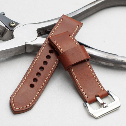 Papaya leather watch strap with natural stitching and polished steel buckle