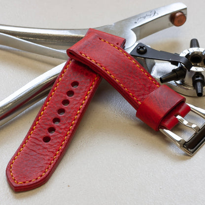 Phoenix leather watch strap with bright yellow stitching and polished steel buckle