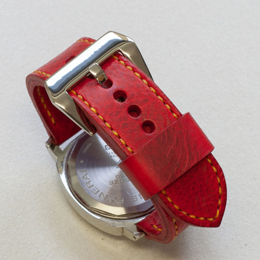 Phoenix leather watch strap with bright yellow stitching and polished steel buckle
