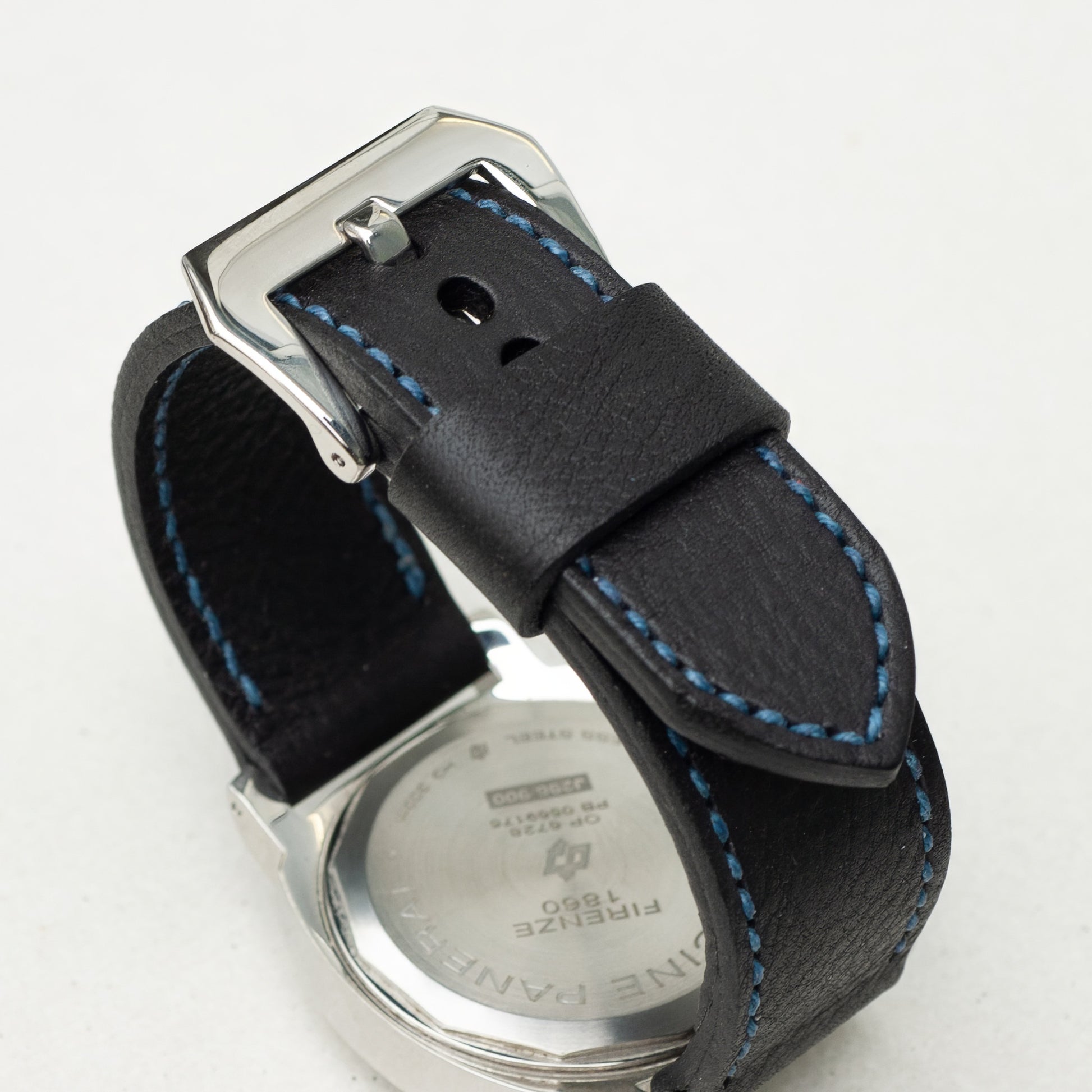 Raven leather watch strap with royal blue stitching and polished steel buckle