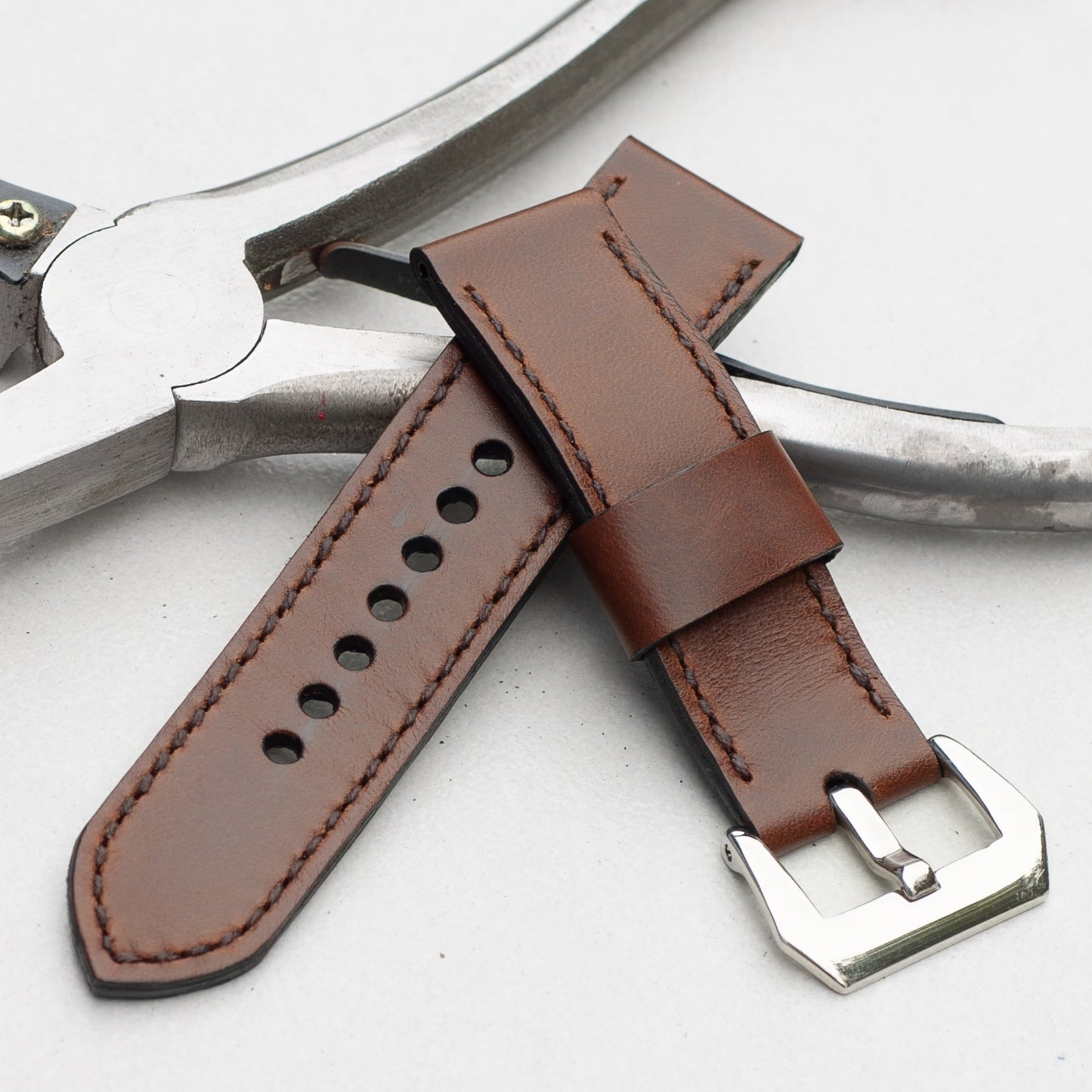 Rodeo leather watch strap with dark brown stitching and polished steel buckle