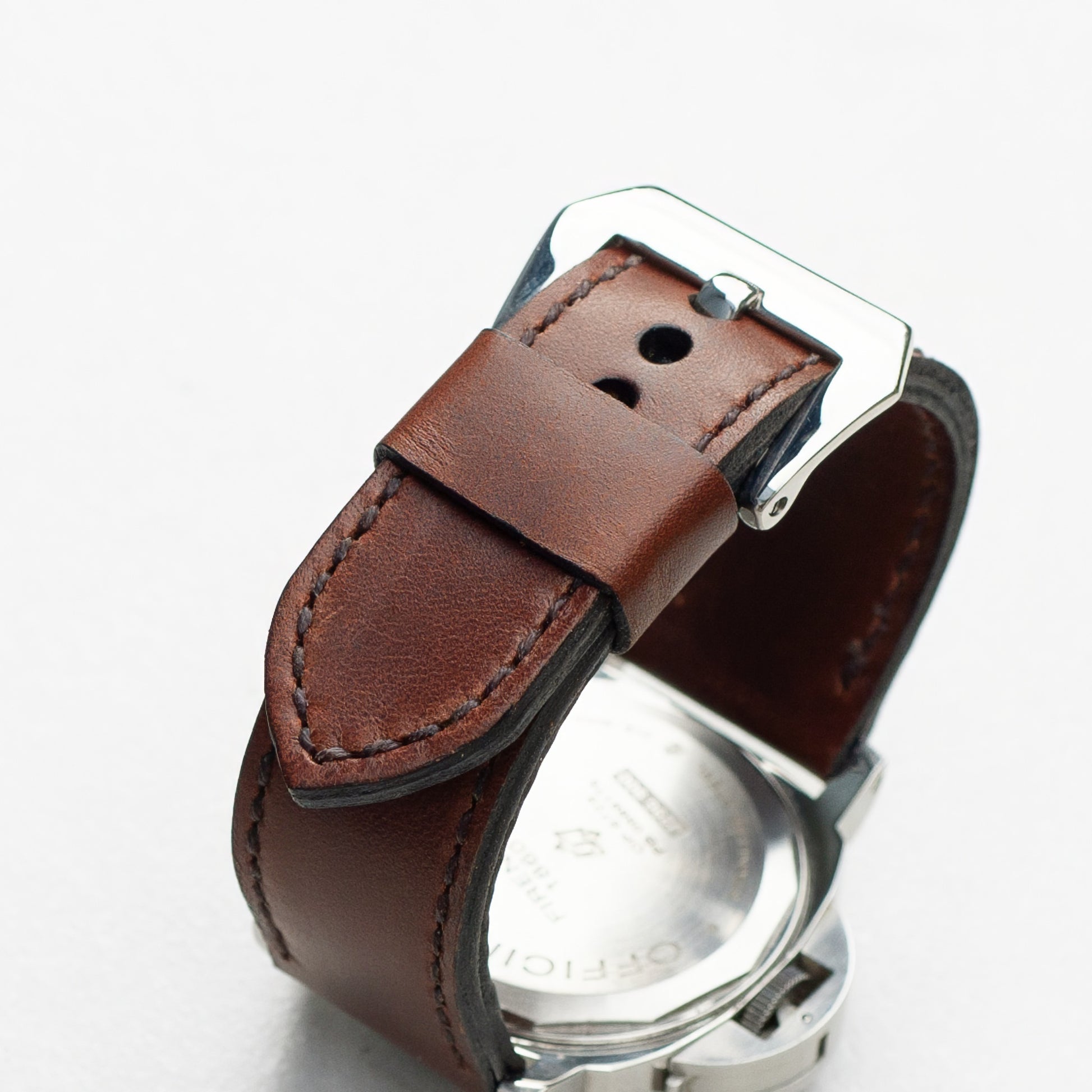 Rodeo leather watch strap with dark brown stitching and polished steel buckle