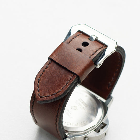 Rodeo leather watch strap with dark brown stitching and polished steel buckle