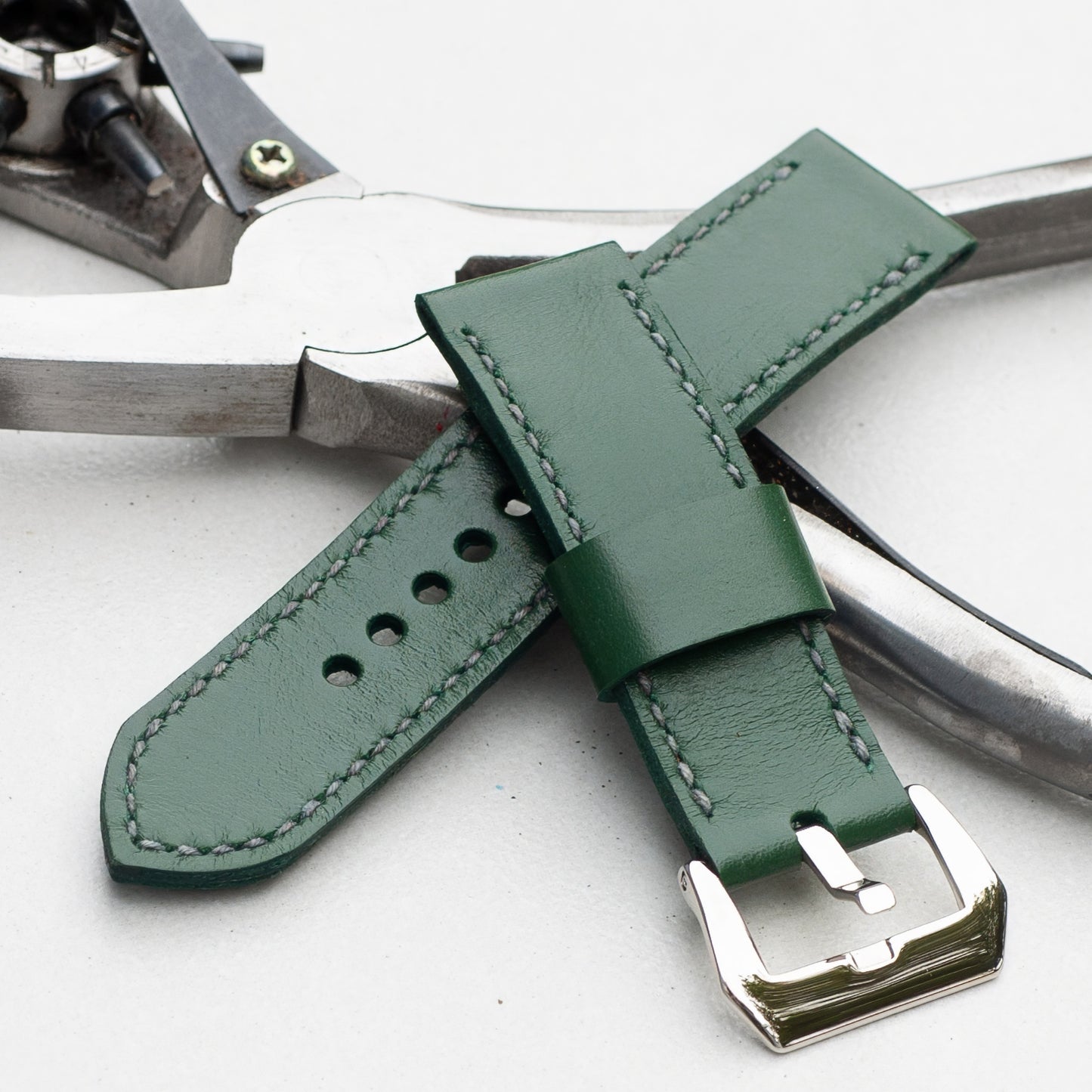 Sage leather watch strap with grey stitching and polished steel buckle