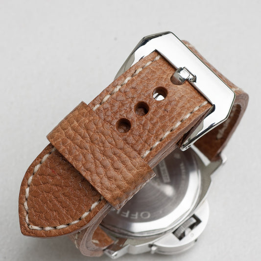 Sandstone leather watch strap with natural stitching and polished steel buckle