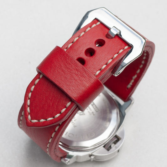 Scarlet leather watch strap with natural stitching and polished steel buckle