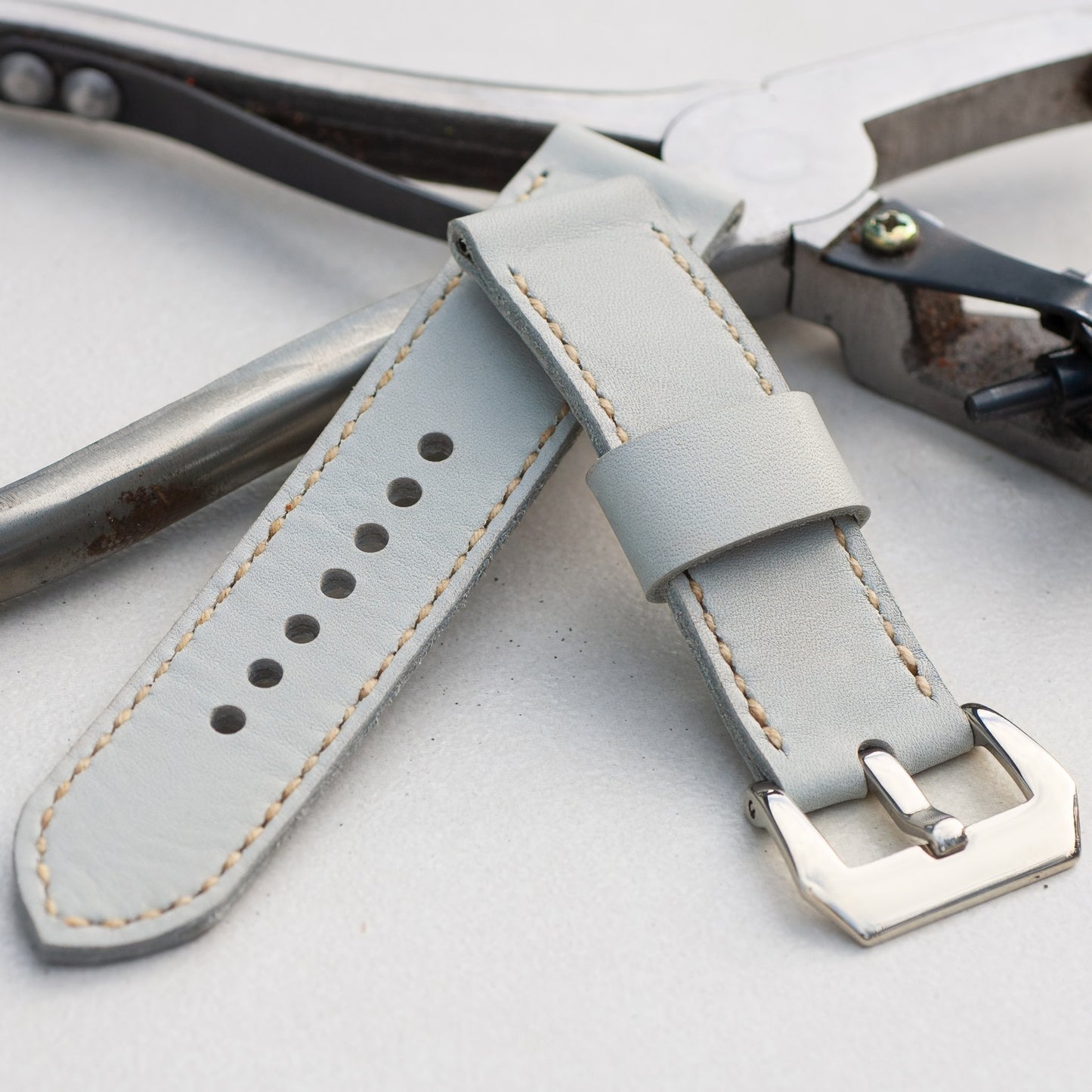 Titan leather watch strap with natural stitching and polished steel buckle