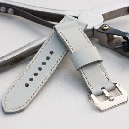 Titan leather watch strap with natural stitching and polished steel buckle