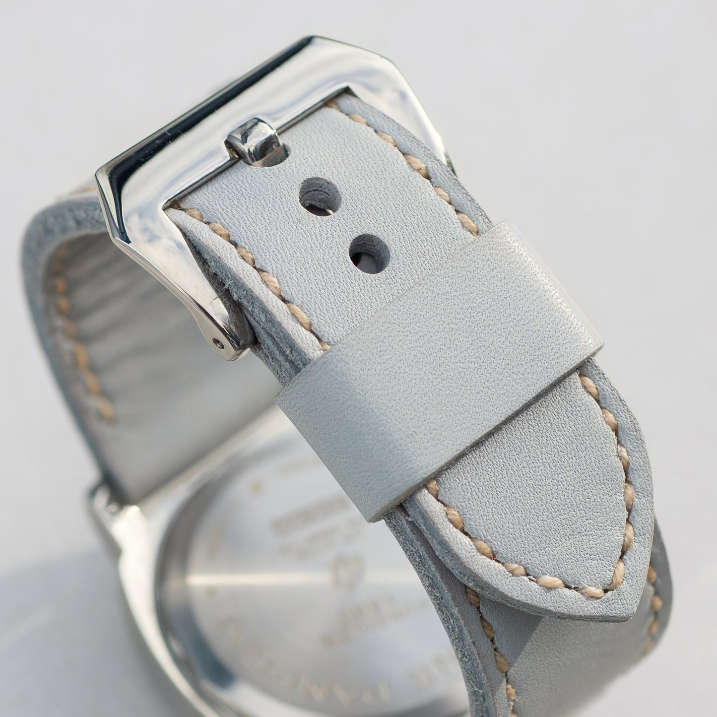 Titan leather watch strap with natural stitching and polished steel buckle