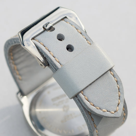 Titan leather watch strap with natural stitching and polished steel buckle