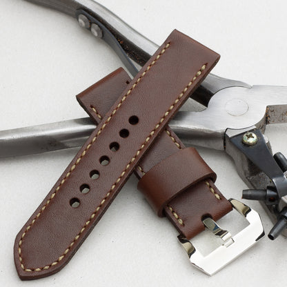 Tobacco leather watch strap with olive drab stitching and polished steel buckle