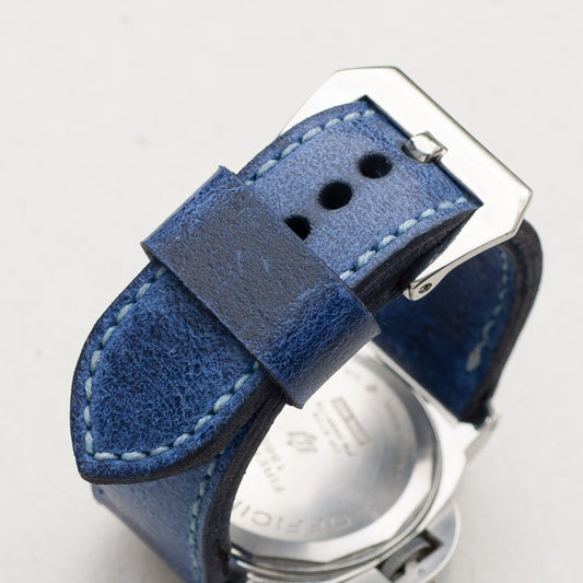 Trident leather watch strap with pale blue stitching and polished steel buckle