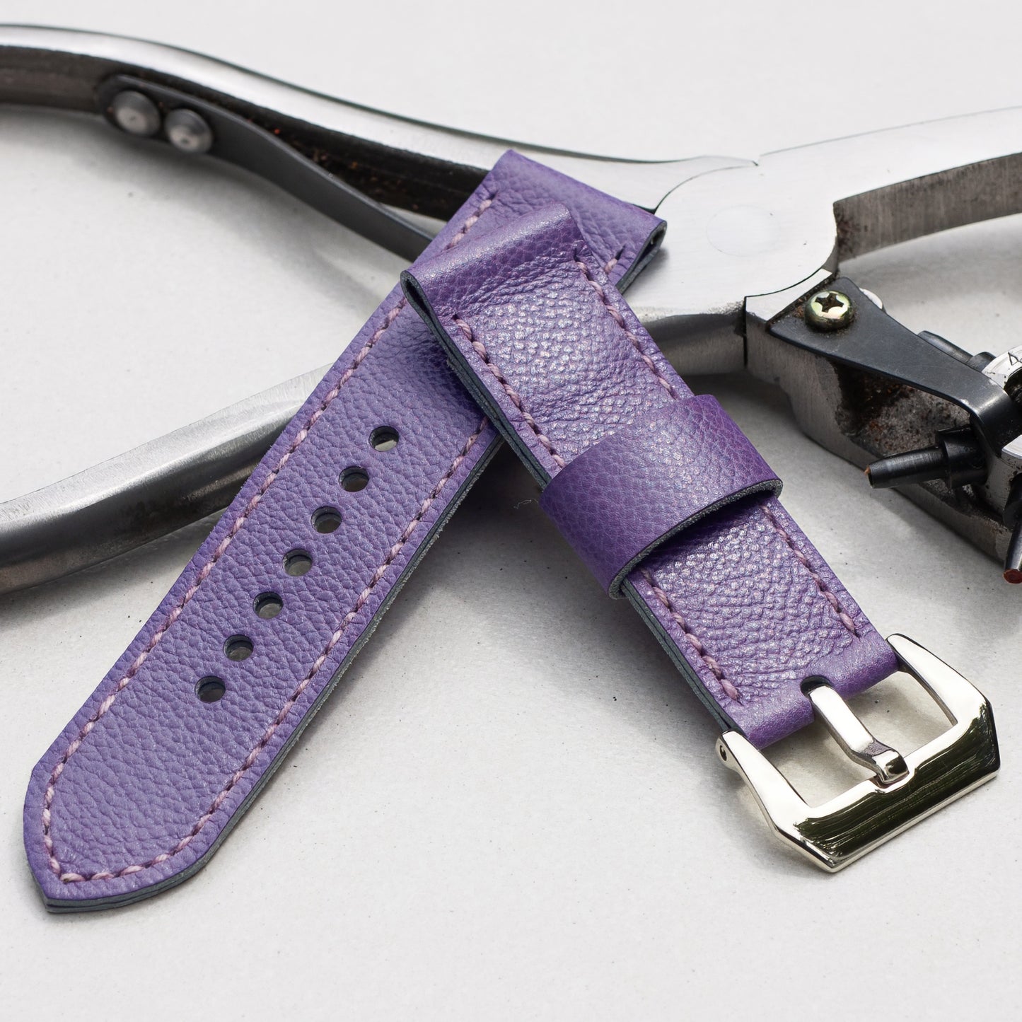 Ultraviolet leather watch strap with lavender stitching and polished steel buckle