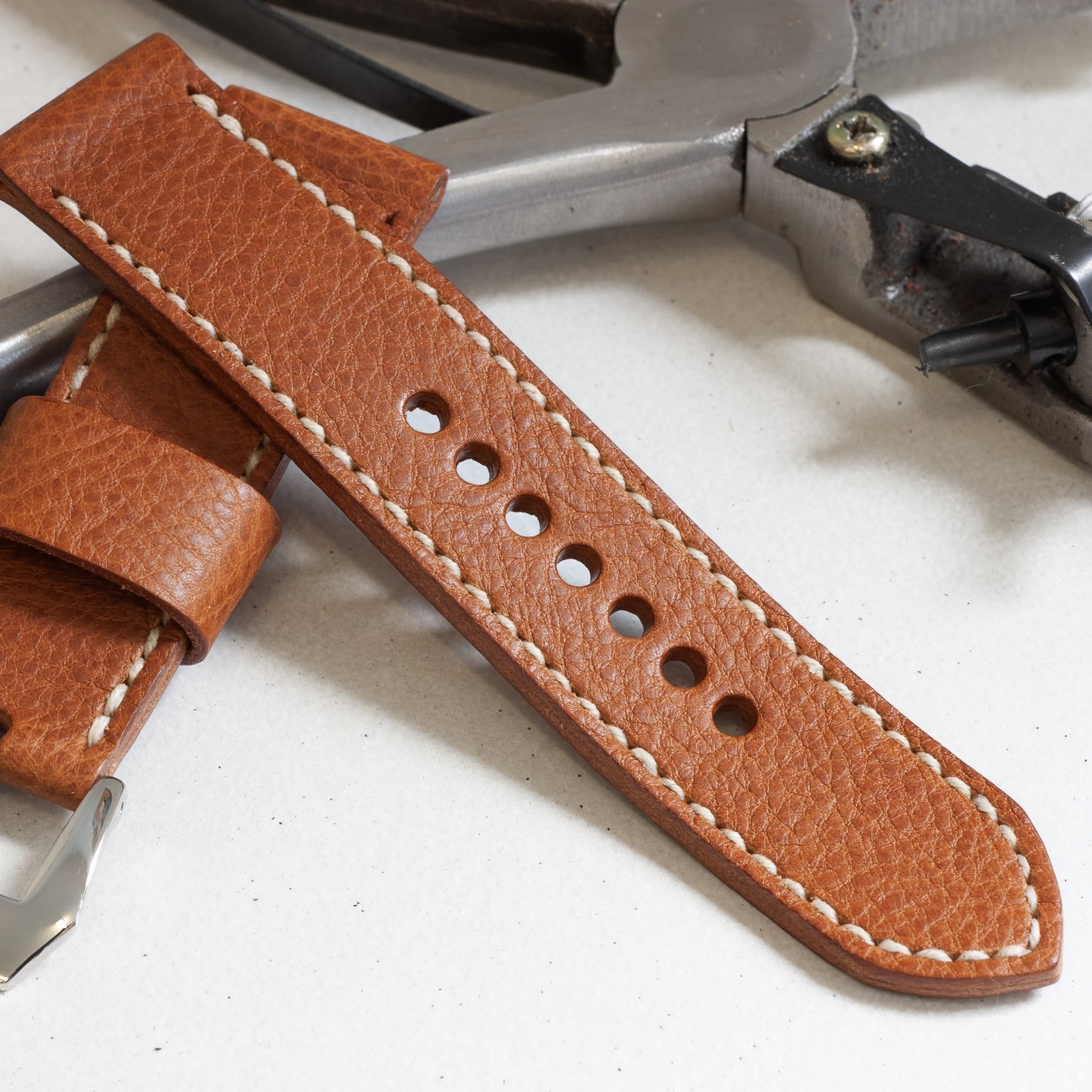 Whisky leather watch strap with natural stitching and polished steel buckle