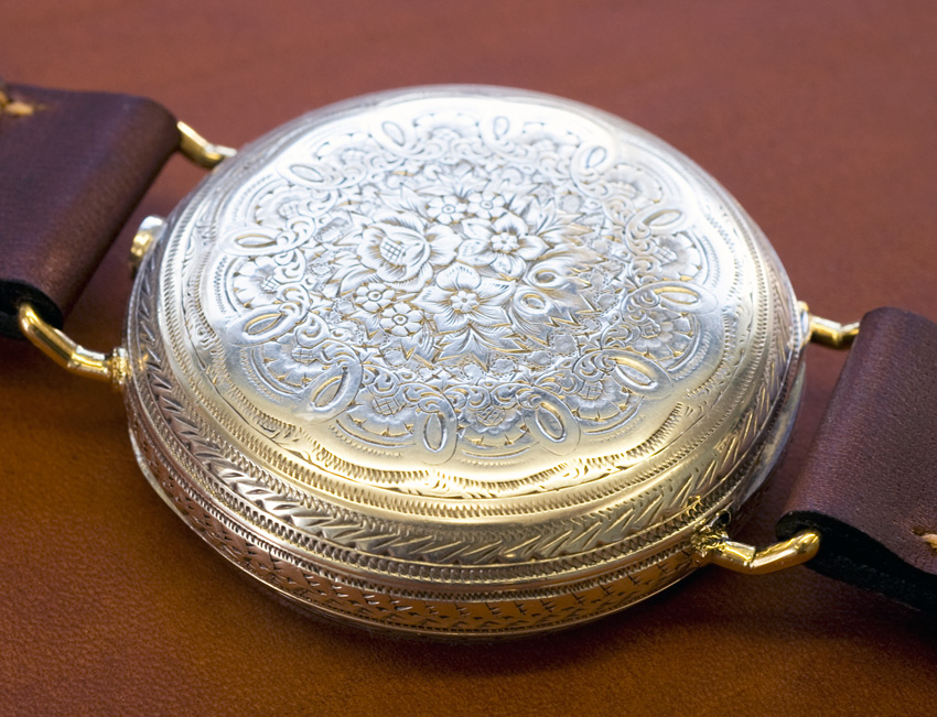 silver pocket watch circa 1870 transforned to wrist watch with fixed bars showing engraving on case