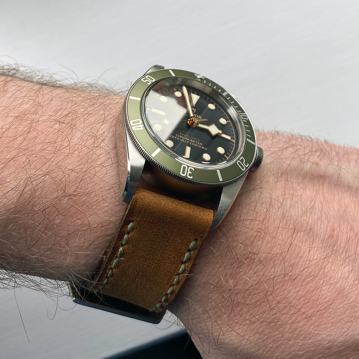 Tudor Black Bay Harrods LE on Old Timer leather with olive drab stitching. © Joshua Getting