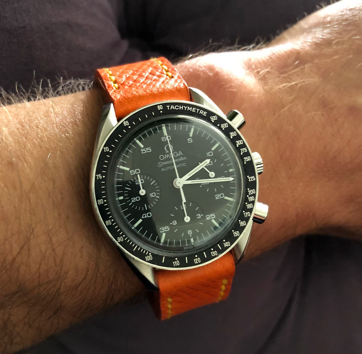 Omega Speedmaster on Orange Crush leather with bright yellow stitching. © Christopher Hill