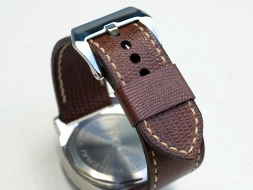 Iguana leather stitched with natural thread
